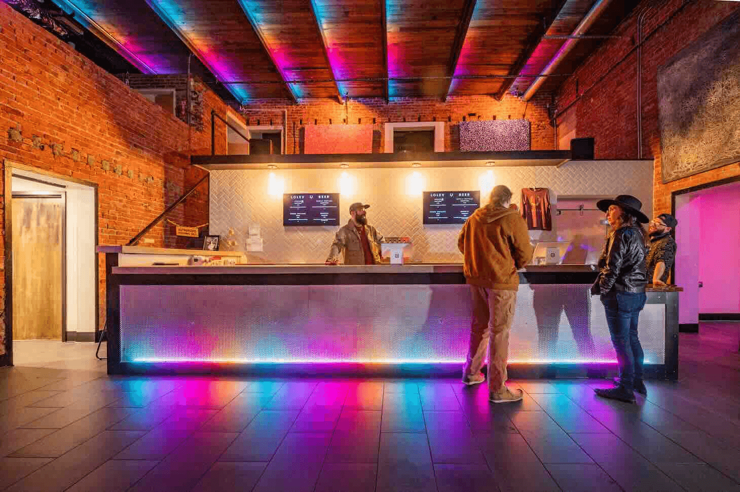 Interior view of Lolev Beer taproom showing bar area with craft beer taps